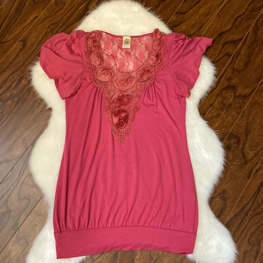 Beautiful pink flutter sleeve top with lace detailing and roses around the neck